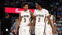 Oct 22, 2025; Memphis, Tennessee, USA; New Orleans Pelicans guard Jordan Poole (3) and forward Herbert Jones (2) react during the second quarter against the Memphis Grizzlies at FedExForum. Mandatory Credit: Petre Thomas-Imagn Images