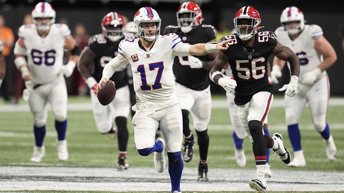 Buffalo Bills quarterback Josh Allen (17) carries the ball against the Atlanta Falcons during the second half of a game at Mercedes-Benz Stadium.