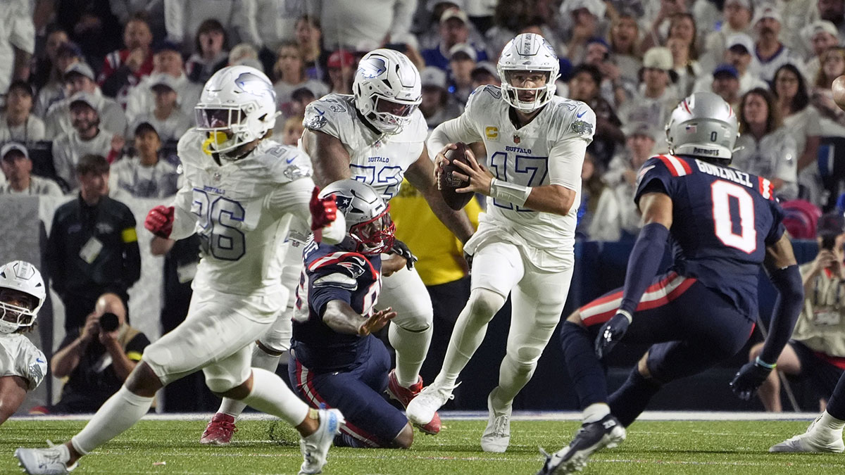 Buffalo Bills quarterback Josh Allen (17) rushes the ball against the New England Patriots during the first half at Highmark Stadium.