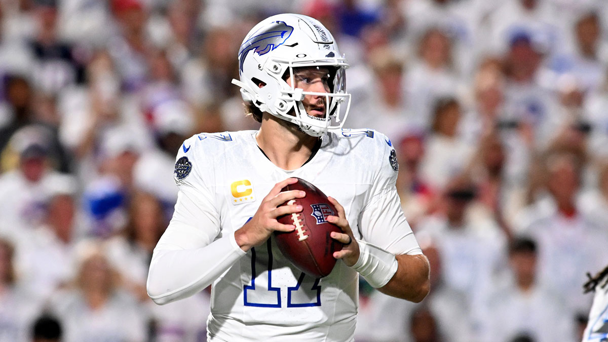 Buffalo Bills quarterback Josh Allen (17) drops back to pass against the New England Patriots during the first half at Highmark Stadium.