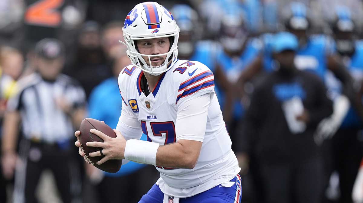 Buffalo Bills quarterback Josh Allen (17) drops to throw during the first half against the Carolina Panthers at Bank of America Stadium.