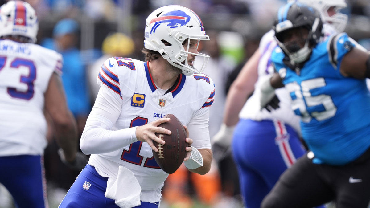 Buffalo Bills quarterback Josh Allen (17) drops to throw during the first half against the Carolina Panthers at Bank of America Stadium.