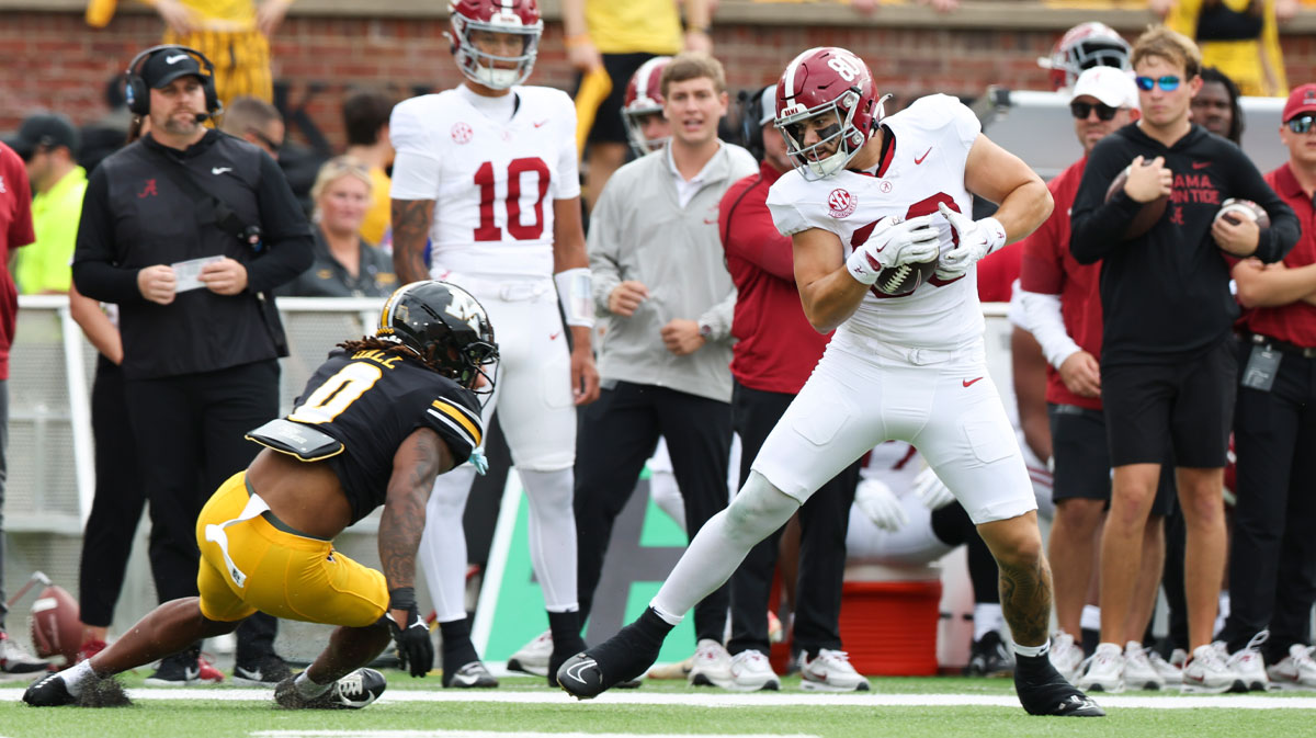 Alabama Crimson Tide tight end Josh Cuevas (80) avoids a tackle against Missouri Tigers cornerback Stephen Hall (0) during the first quarter of the game at Faurot Field at Memorial Stadium.