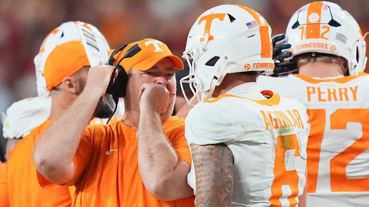 Tennessee coach Josh Heupel talks with Tennessee quarterback Joey Aguilar (6) during a college football game between Tennessee and Alabama at Bryant-Denny Stadium in Tuscaloosa, Ala., on Oct. 18, 2025.