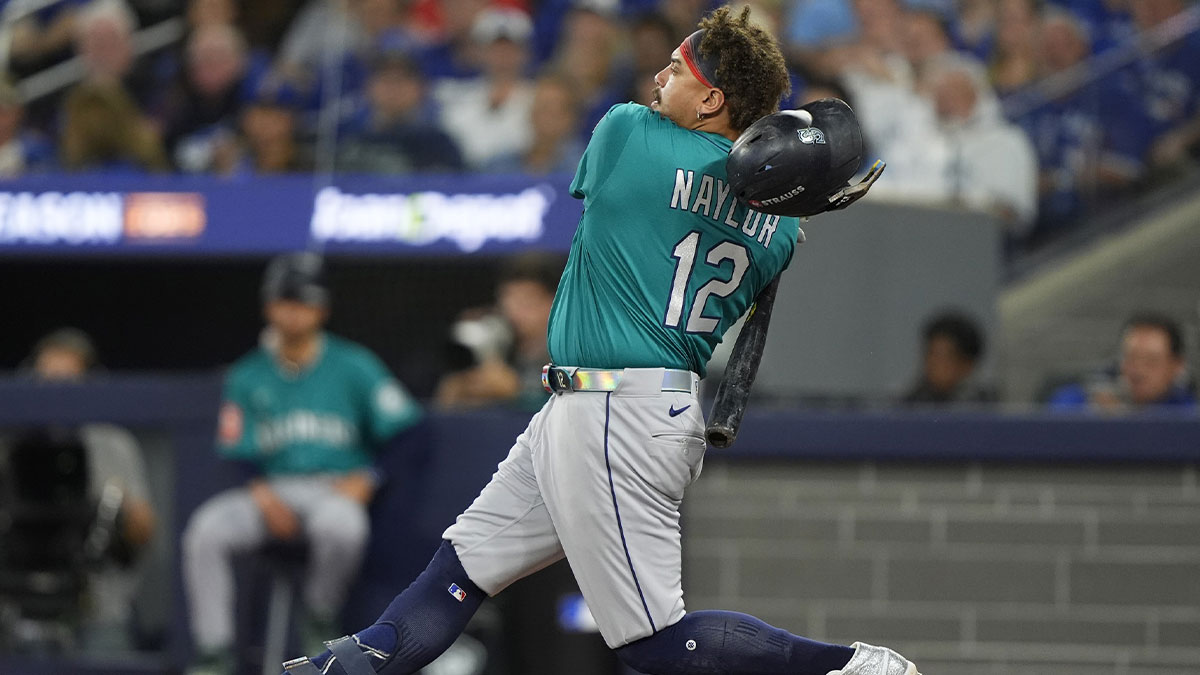 Seattle Mariners first baseman Josh Naylor (12) loses his helmet on a swing against the Toronto Blue Jays in the eighth inning during game one of the ALCS round for the 2025 MLB playoffs at Rogers Centre.