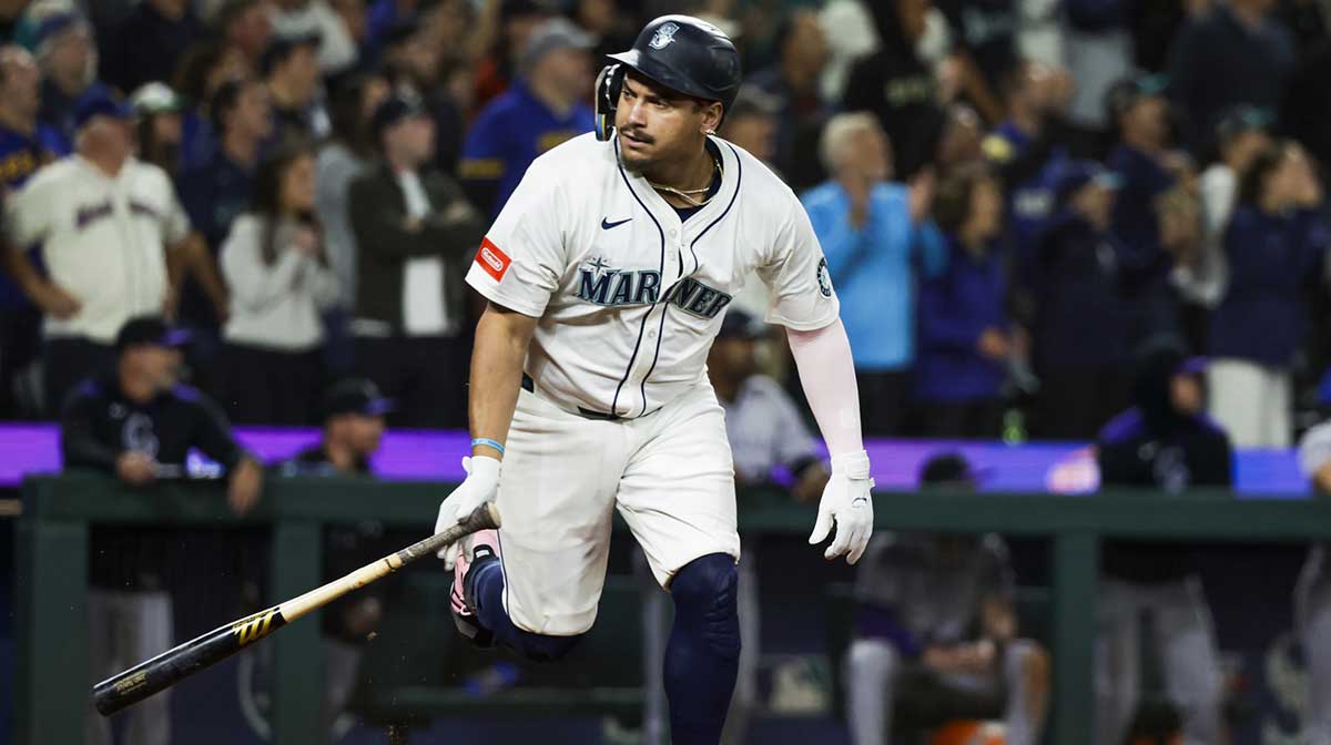 Seattle Mariners first baseman Josh Naylor (12) reacts towards the Mariners dugout after hitting a three-run double against the Colorado Rockies during the eighth inning at T-Mobile Park.