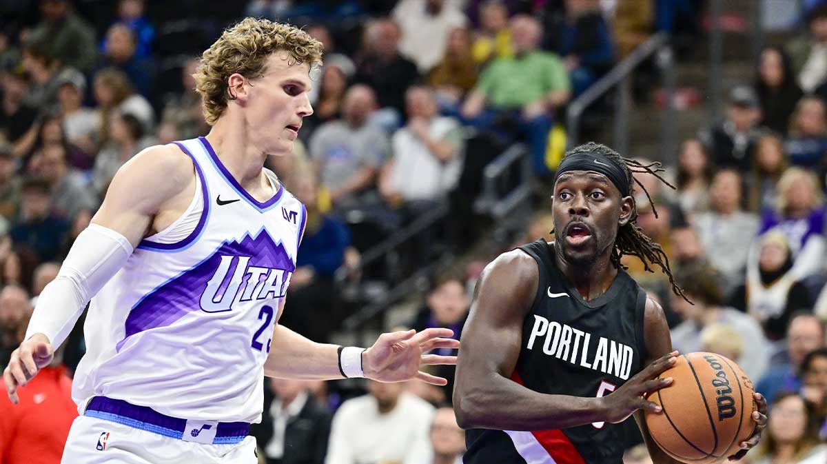 Portland Trail Blazers guard Jrue Holiday (5) looks to pass the ball around Utah Jazz forward/center Lauri Markkanen (23) during the first half at Delta Center.