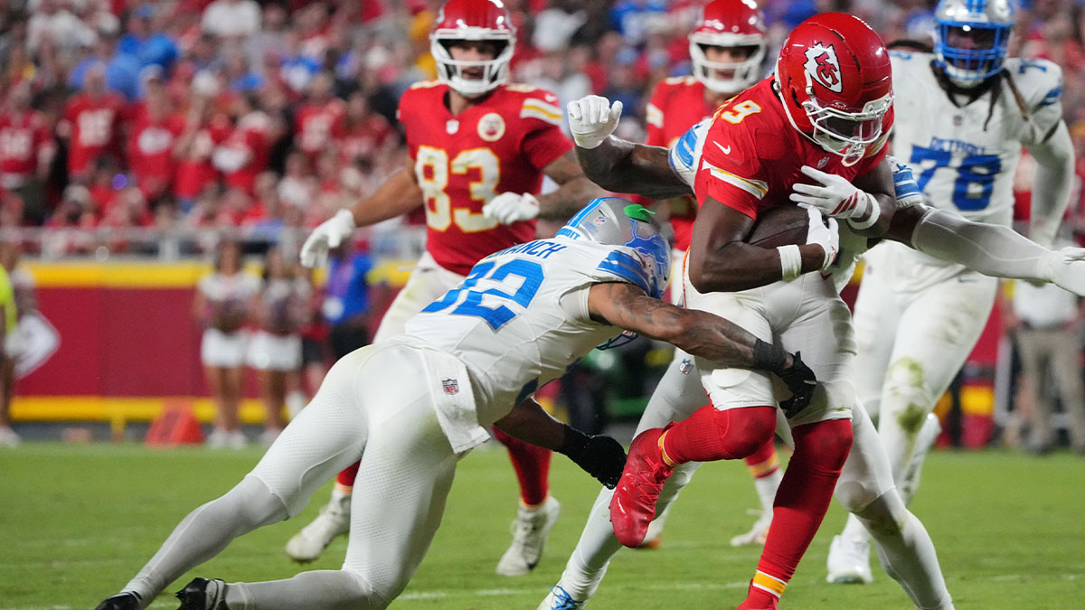 Kansas City Chiefs wide receiver Juju Smith-Schuster (9) makes a catch over Detroit Lions safety Brian Branch (32) during the second half at GEHA Field at Arrowhead Stadium. Mandatory Credit: Denny Medley-Imagn Images