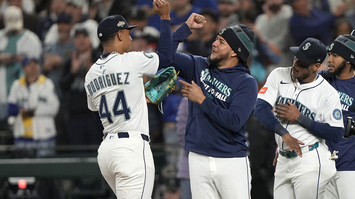Seattle Mariners center fielder Julio Rodriguez (44) and pitcher Luis Castillo (58) celebrate after defeating the Detroit Tigers in game two of the ALDS round for the 2025 MLB playoffs at T-Mobile Park.