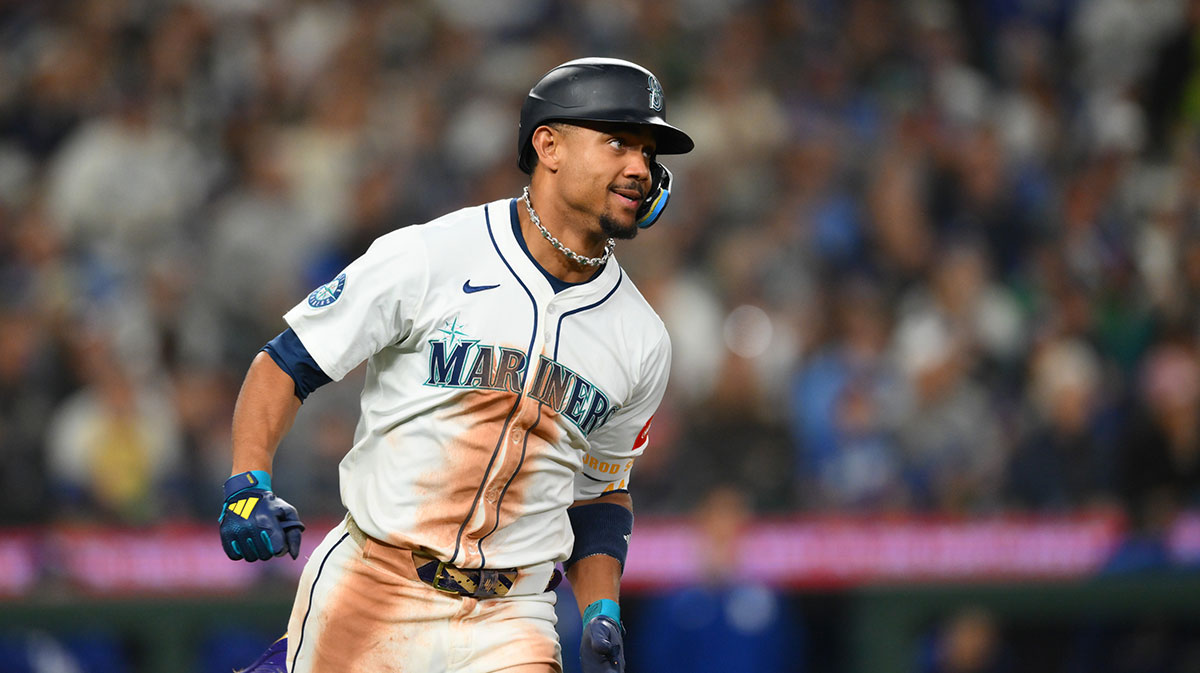 Seattle Mariners center fielder Julio Rodriguez (44) runs towards first base after hitting a single against the Los Angeles Dodgers during the fifth inning at T-Mobile Park.