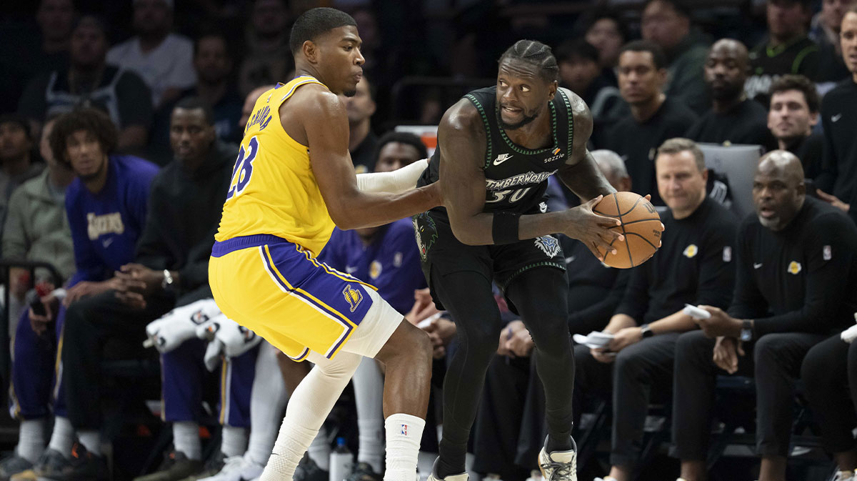 Minnesota Timberwolves forward Julius Randle (30) looks to pass the ball around Los Angeles Lakers forward Rui Hachimura (28) in the second half at Target Center.