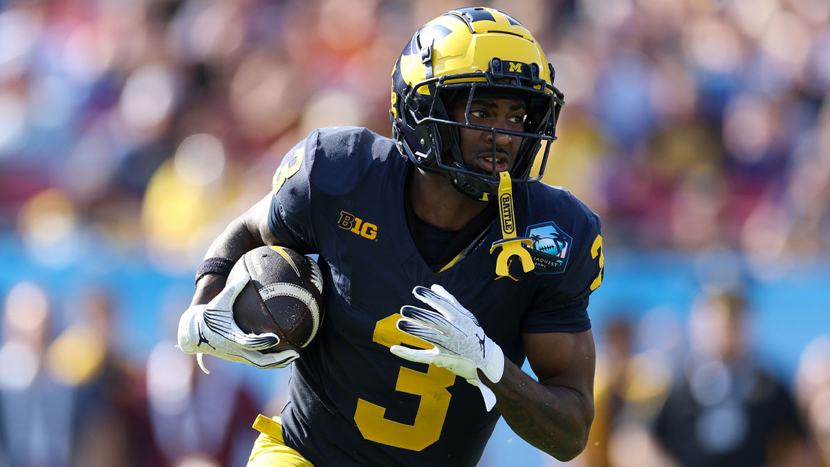 Michigan Wolverines wide receiver Fredrick Moore (3) runs with the ball against the Alabama Crimson Tide in the third quarter during the ReliaQuest Bowl at Raymond James Stadium.