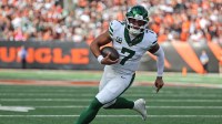 New York Jets quarterback Justin Fields (7) runs with the ball during the fourth quarter against the Cincinnati Bengals at Paycor Stadium.
