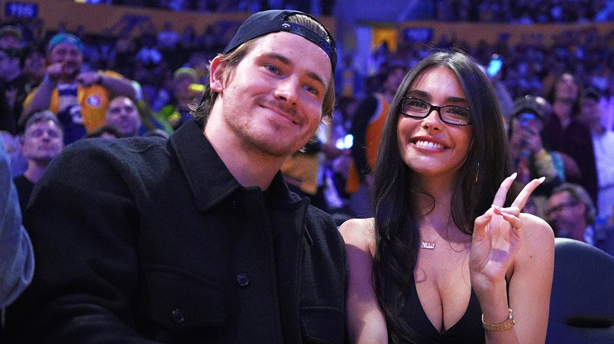 Los Angeles Chargers quarterback Justin Herbert (left) and girlfriend Madison Beer attend the game between the Minnesota Timberwolves and the Los Angeles Lakers at Crypto.com Arena.