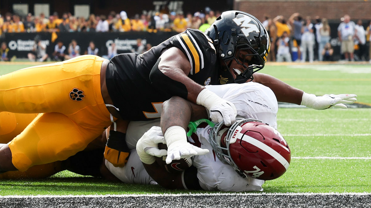 Alabama Crimson Tide offensive lineman Kadyn Proctor (74) is stopped short of the end zone by Missouri Tigers linebacker Josiah Trotter (40) during the third quarter at Faurot Field at Memorial Stadium.
