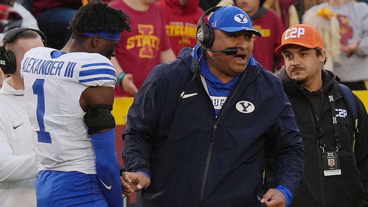 BYU Cougars football head coach Kalani Sitake celebrates after a defensive stop against Iowa State during the fourth quarter at Jack Trice Stadium on Oct. 25, 2025, in Ames, Iowa.