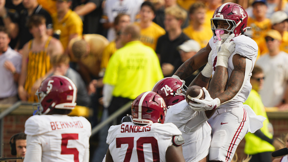 Alabama Crimson Tide running back Daniel Hill (4) celebrates his touchdown against the Missouri Tigers during the second half of the game at Faurot Field at Memorial Stadium.