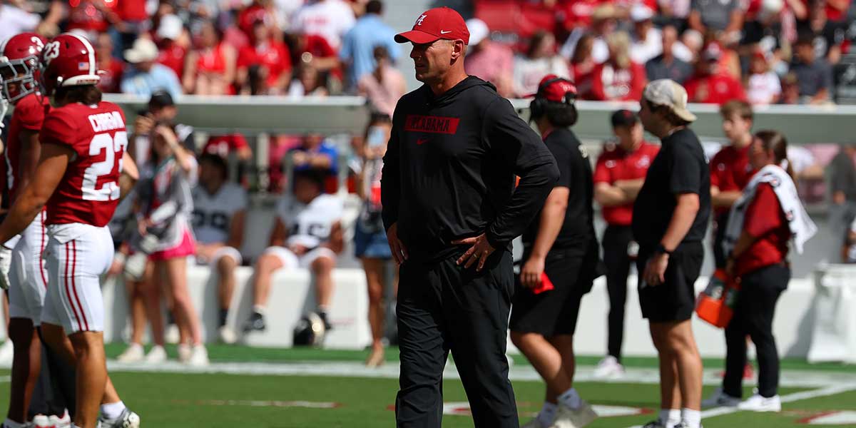 Alabama Crimson Tide head coach Kalen DeBoer runs drills with his team before a game against the Vanderbilt Commodores.
