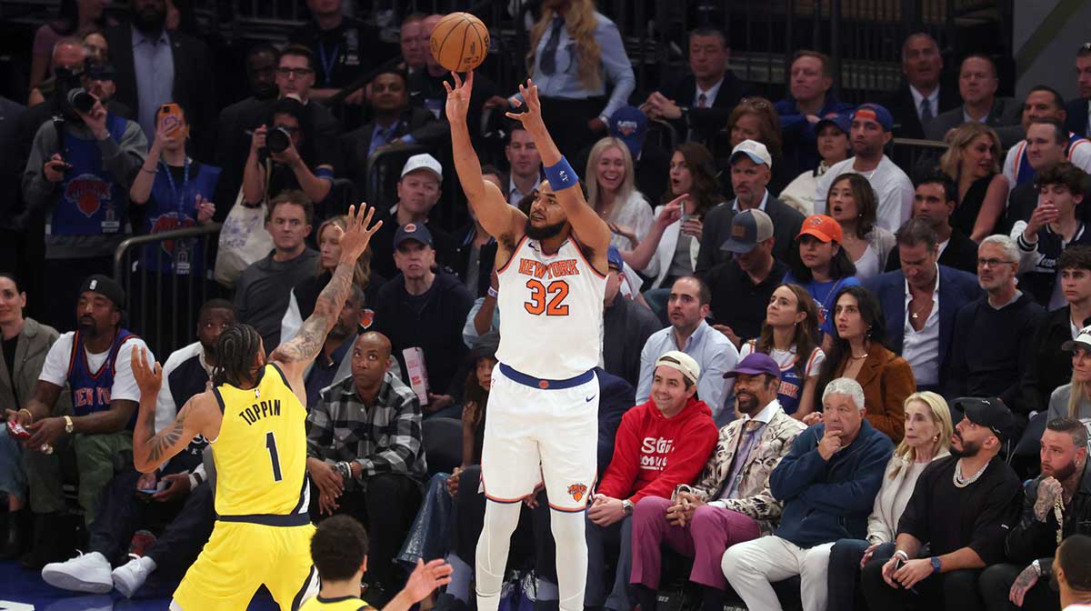 New York Knicks center Karl-Anthony Towns (32) shoots a three point shot against Indiana Pacers forward Obi Toppin (1) in the first quarter during game five of the eastern conference finals for the 2025 NBA Playoffs at Madison Square Garden.