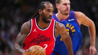LA Clippers forward Kawhi Leonard (2) controls the ball in the first quarter against the Denver Nuggets during game seven of first round for the 2025 NBA Playoffs at Ball Arena.