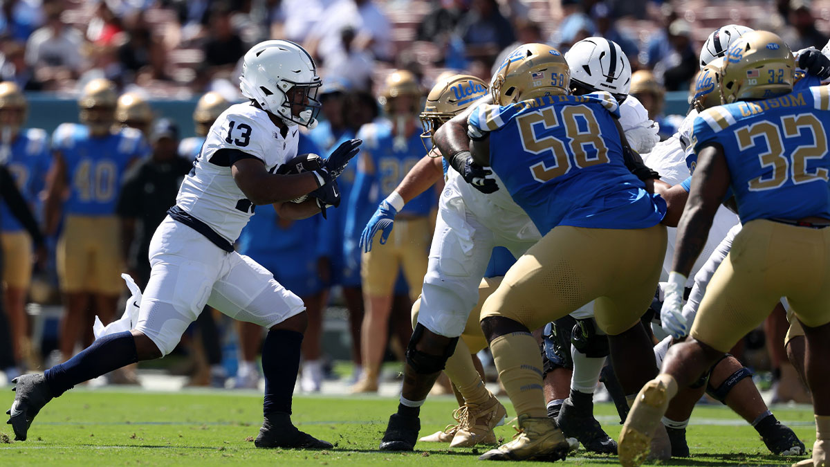 Penn State Nittany Lions running back Kaytron Allen (13) runs for a touchdown during the first quarter against the UCLA Bruins at Rose Bowl.