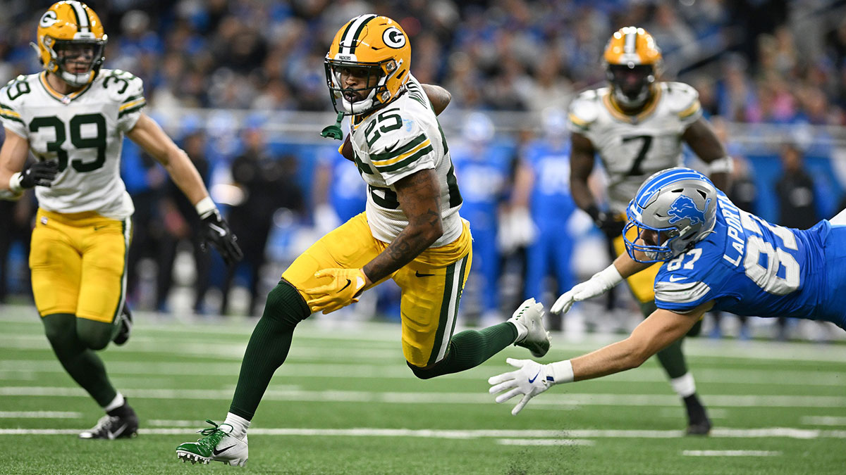 Green Bay Packers cornerback Keisean Nixon (25) runs upfield after intercepting a pass against the Detroit Lions in the third quarter at Ford Field.