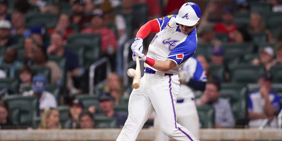 Atlanta Braves right fielder Jarred Kelenic (24) hits a single against the Minnesota Twins in the sixth inning at Truist Park