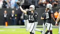 Las Vegas Raiders quarterback Kenny Pickett (15) warms up before the game against the Tennessee Titans at Allegiant Stadium