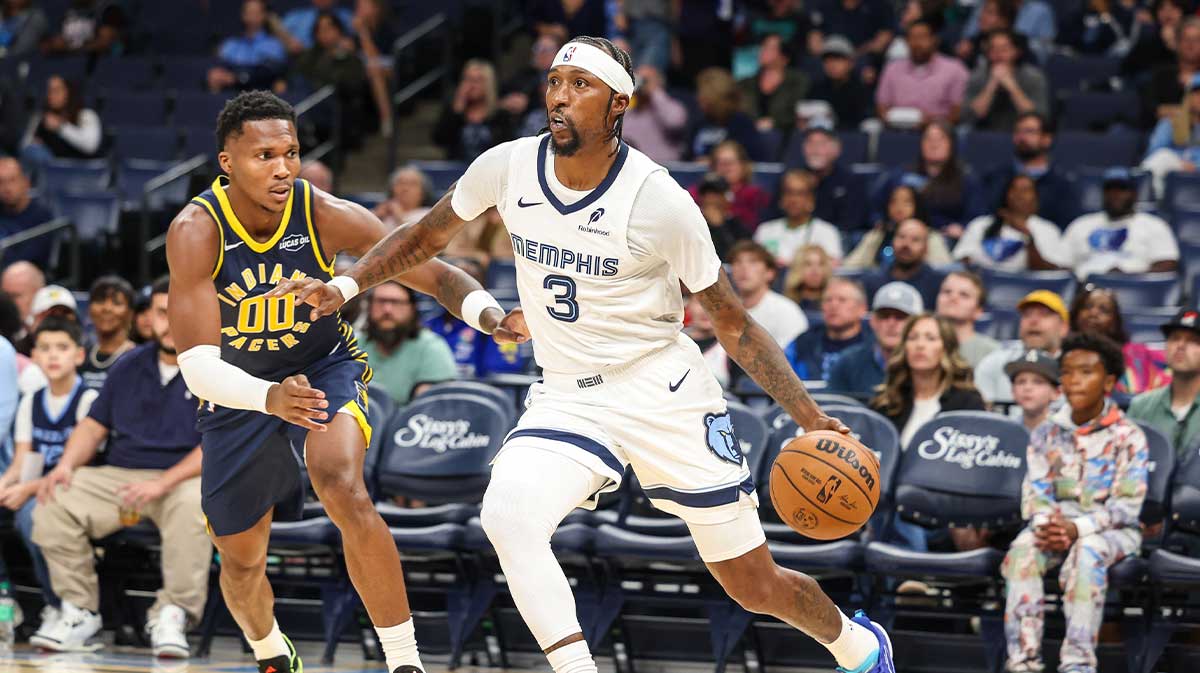 Memphis Grizzlies guard Kentavious Caldwell-Pope (3) dribbles the ball against Indiana Pacers forward Bennedict Mathurin (0) during the first half at FedExForum.