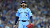 Toronto Blue Jays pitcher Kevin Gausman (34) reacts after striking out Los Angeles Dodgers first baseman Freddie Freeman (5) in the first inning during game six of the 2025 MLB World Series at Rogers Centre.