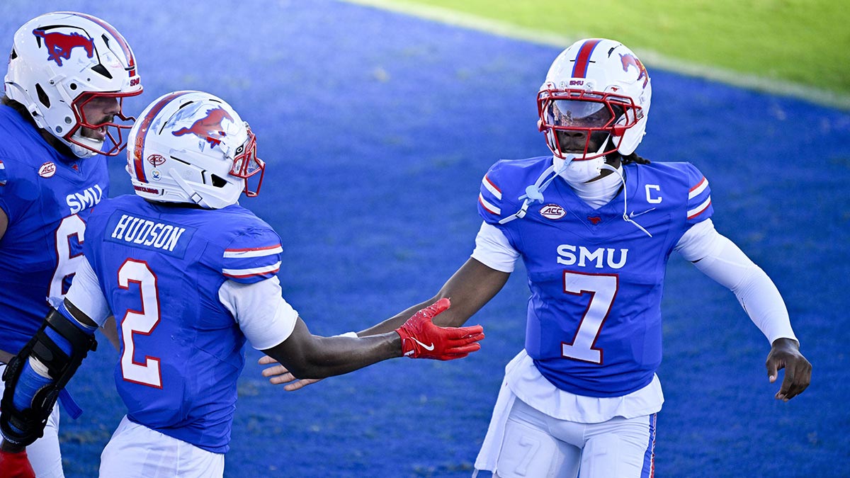 SMU Mustangs wide receiver Jordan Hudson (2) and quarterback Kevin Jennings (7) celebrate a touchdown against the Syracuse Orange during the second half at Gerald J. Ford Stadium.