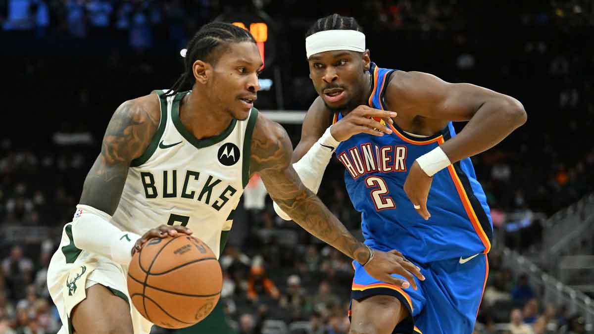 Milwaukee Bucks guard/forward Kevin Porter Jr. (7) drives the ball against Oklahoma City Thunder guard Shai Gilgeous-Alexander (2) during the first half at Fiserv Forum.