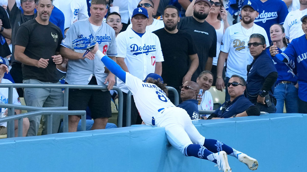 Los Angeles Dodgers first baseman Enrique Hernandez (8) makes a catch for an out against Toronto Blue Jays right fielder Nathan Lukes (not pictured) in the first inning during game four of the 2025 MLB World Series at Dodger Stadium.