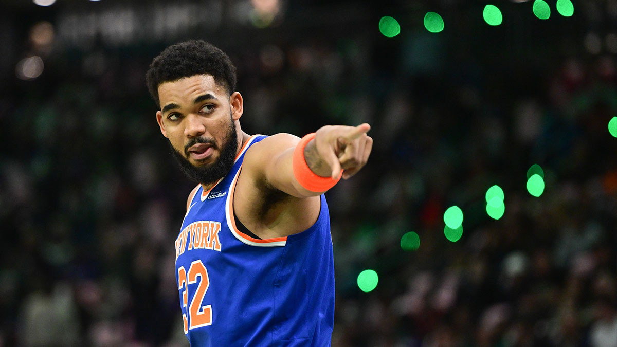 Knicks center Karl-Anthony Towns (32) gestures to fans before game against the Milwaukee Bucks at Fiserv Forum