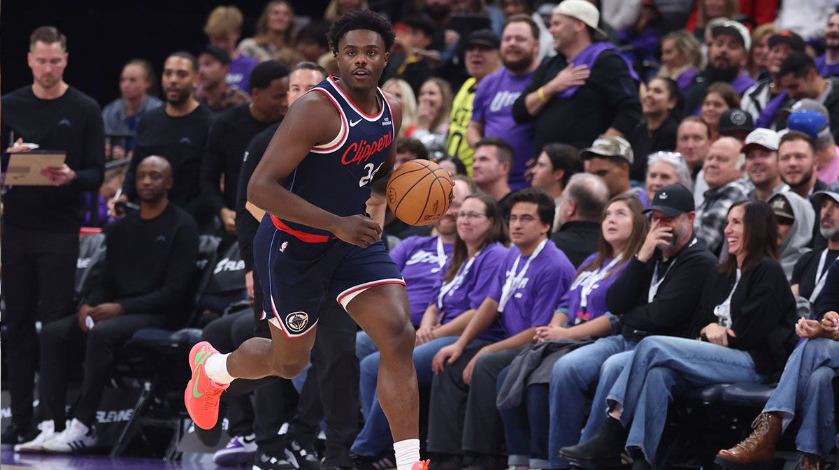 Los Angeles Clippers guard Kobe Brown (24) brings the ball up the court against the Utah Jazz during the second half at Delta Center.