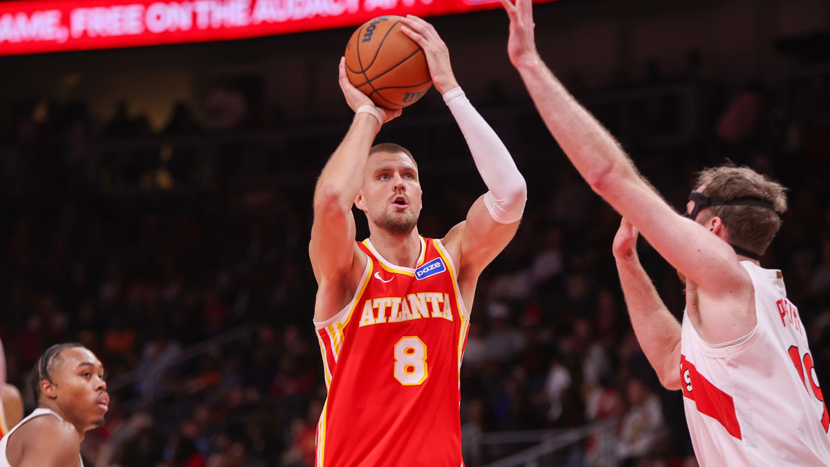 Atlanta Hawks center Kristaps Porzingis (8) shoots against the Toronto Raptors in the second quarter at State Farm Arena.