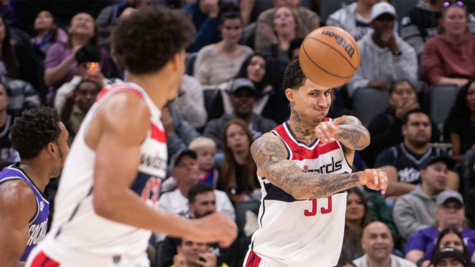 Washington Wizards forward Kyle Kuzma (33) passes the ball to guard Jordan Poole (13) during the second quarter of the game against the Sacramento Kings at Golden 1 Center.