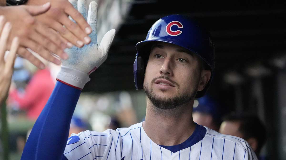 Chicago Cubs outfielder Kyle Tucker (30) is greeted in the dugout after scoring against the San Diego Padres during game three of the Wildcard round for the 2025 MLB playoffs at Wrigley Field.