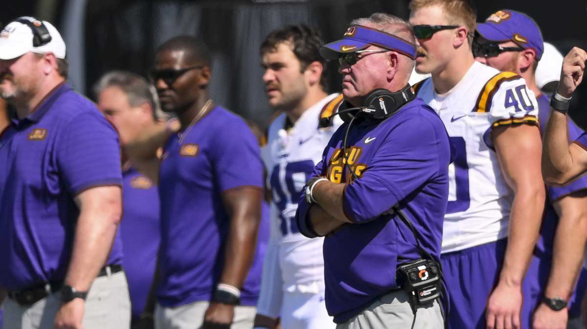 LSU football faces mounting pressure on Brian Kelly as his Tigers plummet in the AP Top 25 following a stunning upset by Vanderbilt football.
