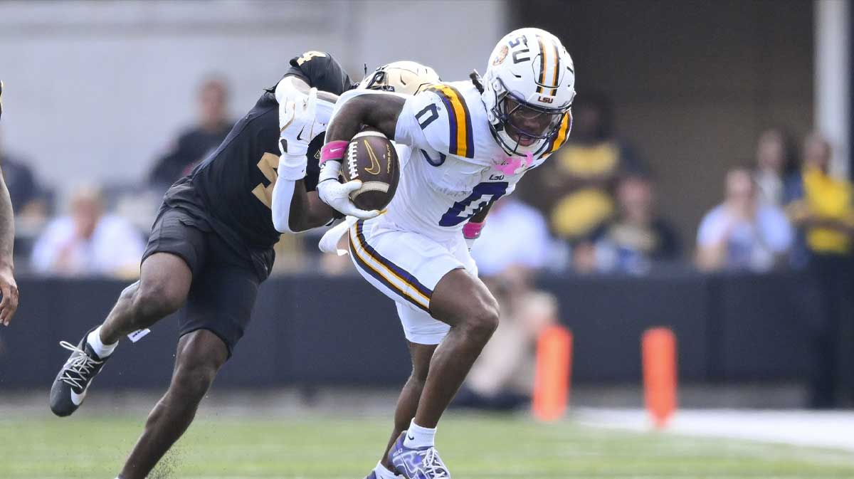 Louisiana State Tigers wide receiver Zavion Thomas (0) breaks the tackle of Vanderbilt Commodores cornerback Martel Hight (4) during the second half at FirstBank Stadium.