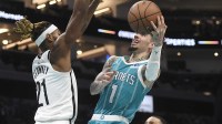 Charlotte Hornets guard LaMelo Ball (1) shoots as he is defended by Brooklyn Nets forward Noah Clowney (21) during the second half at the Spectrum Center.