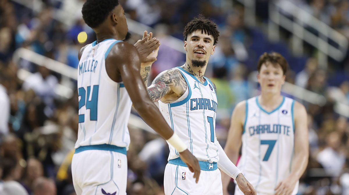 Charlotte Hornets guard LaMelo Ball (1) celebrates with forward Brandon Miller (24) during the second half against the Memphis Grizzlies at First Horizon Coliseum.