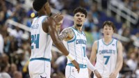 Charlotte Hornets guard LaMelo Ball (1) celebrates with forward Brandon Miller (24) during the second half against the Memphis Grizzlies at First Horizon Coliseum.