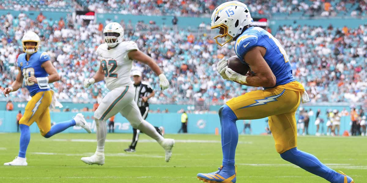 Los Angeles Chargers wide receiver Ladd McConkey (15) scoress a touchdown against the Miami Dolphins during the third quarter at Hard Rock Stadium.
