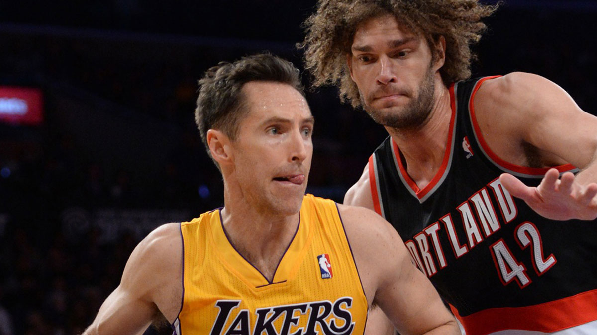 Portland Trail Blazers center Robin Lopez (42) guards Los Angeles Lakers guard Steve Nash (10) during the second half of the game at Staples Center.