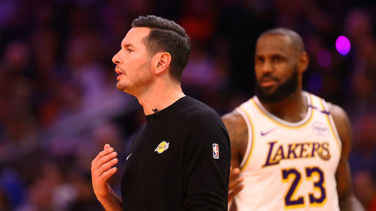 Lakers head coach JJ Redick and forward LeBron James (23) against the Phoenix Suns during an NBA Cup game at Footprint Center