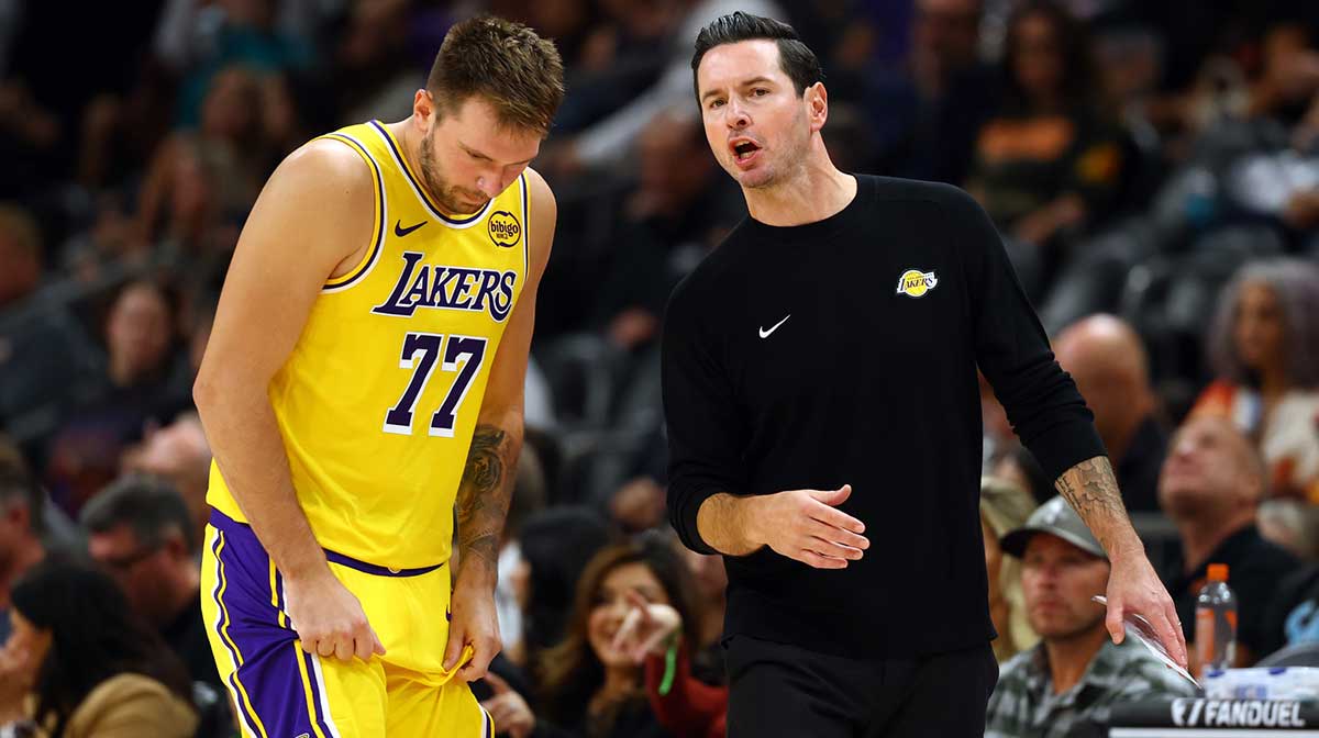 Los Angeles Lakers guard Luka Doncic (77) with head coach JJ Redick against the Phoenix Suns during an NBA preseason game at Mortgage Matchup Center.