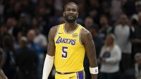 Lakers center Deandre Ayton (5) looks on against the Minnesota Timberwolves in the first half at Target Center with the Grizzlies logo in the background