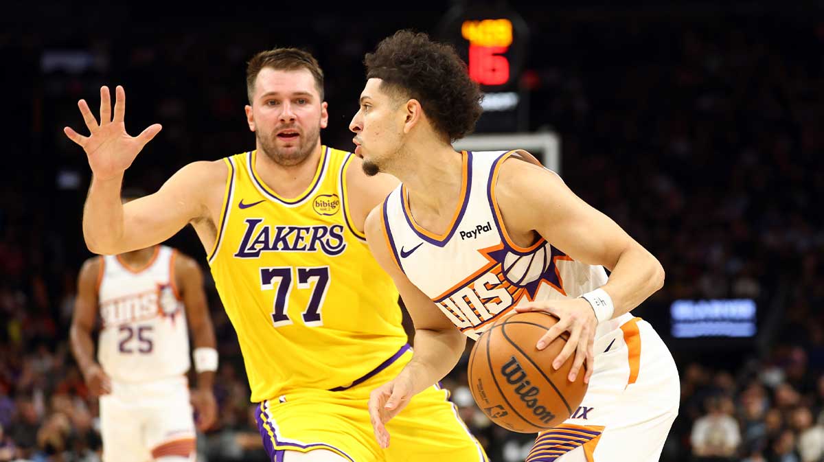 Lakers guard Luka Doncic defends Suns player