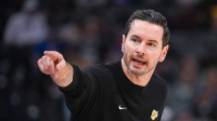Los Angeles Lakers head coach JJ Redick makes a call to the bench during the first quarter of the game against the Sacramento Kings at Golden 1 Center.